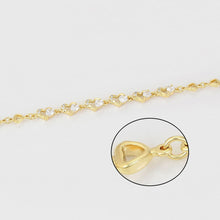 Load image into Gallery viewer, Gold bracelet with heart-shaped clasp on a white background.