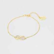 Load image into Gallery viewer, 14 K Gold Plated infinity bracelet with white zirconia
