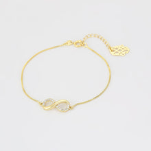 Load image into Gallery viewer, 14 K Gold Plated infinity bracelet with white zirconia