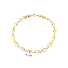 Load image into Gallery viewer, Gold bracelet with heart designs and clear stones on a white background.