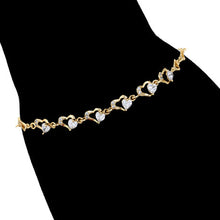 Load image into Gallery viewer, Gold bracelet with pearls on a hand silhouette.