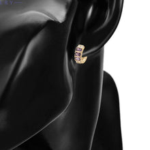 Load image into Gallery viewer, Gold plated huggy earrings with purple zirconia