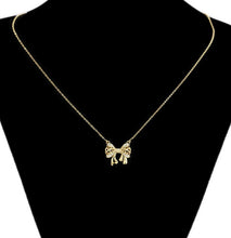 Load image into Gallery viewer, 14 K Gold Plated bow necklace, bracelet and earrings set with white zirconium
