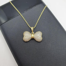 Load image into Gallery viewer, 14 K Gold Plated bow pendant with white zirconium - BIJUNET