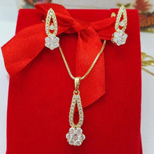 Load image into Gallery viewer, 14 K Gold Plated flower pendant and earrings set with white zirconium - BIJUNET
