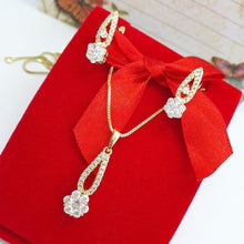 Load image into Gallery viewer, 14 K Gold Plated flower pendant and earrings set with white zirconium - BIJUNET