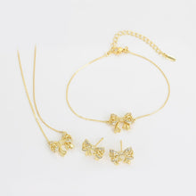 Load image into Gallery viewer, 14 K Gold Plated bow necklace, bracelet and earrings set with white zirconium