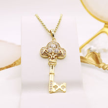 Load image into Gallery viewer, 14 K Gold Plated key pendant with white zirconia