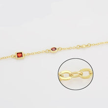 Load image into Gallery viewer, Gold bracelet with gemstones and close-up of a gold chain link on a white background.
