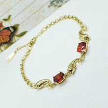 Load image into Gallery viewer, 14 K Gold Plated dolphins bracelet with red zirconium - BIJUNET
